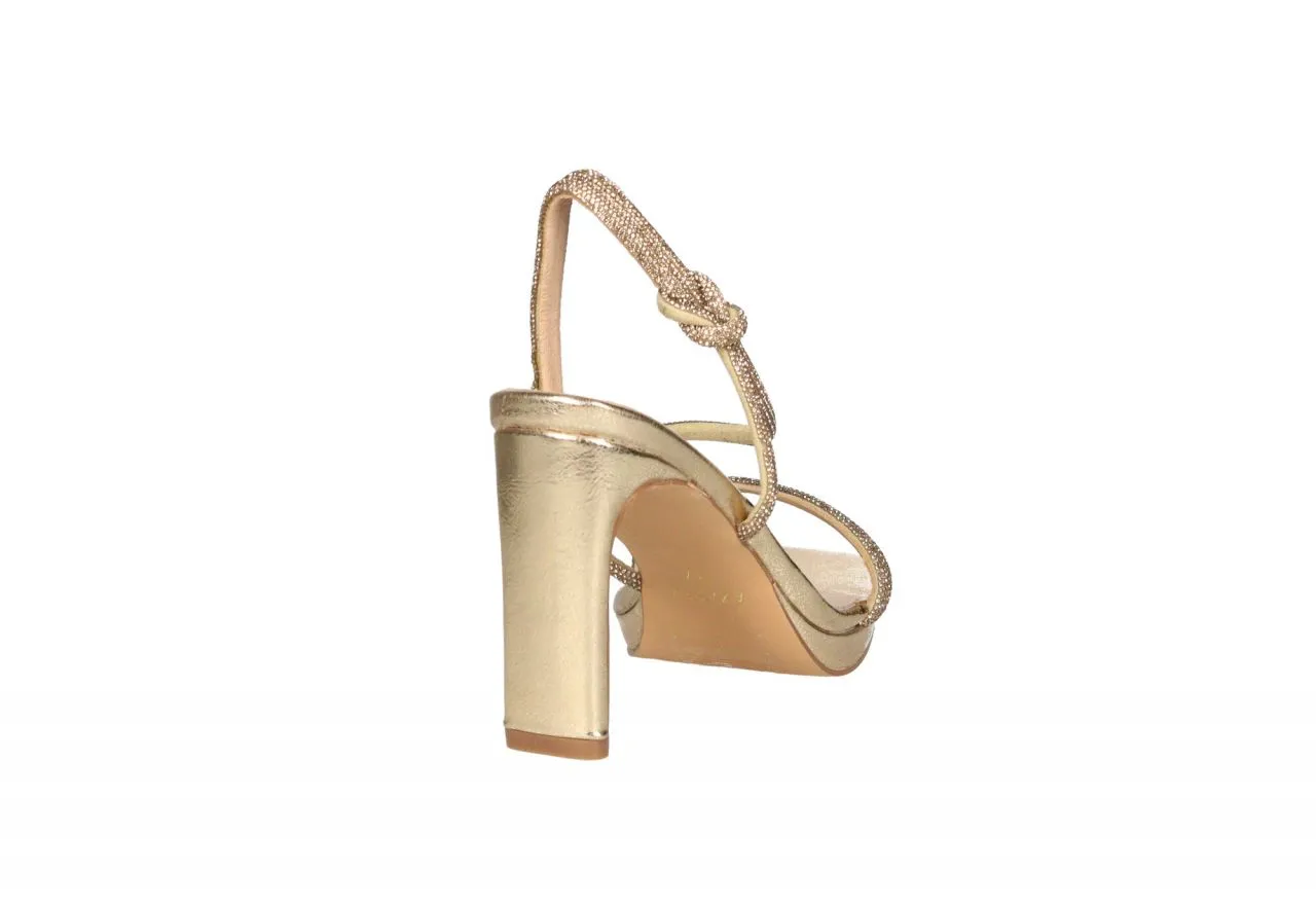 Sandalia Dorada Brillantes Tira Talon Nudo y Elastico Tacon Alto